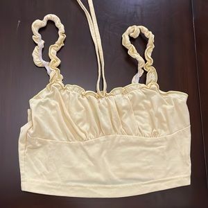 i’m selling this light yellow crop tang top.
